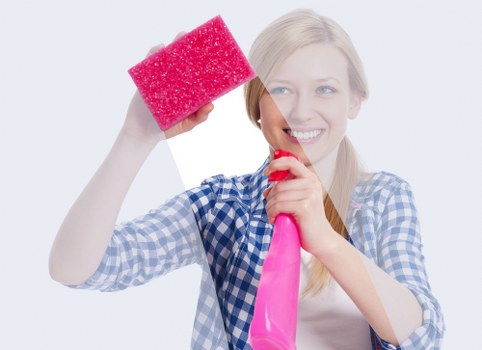 Technician checking cleaning products and site hazards before starting work