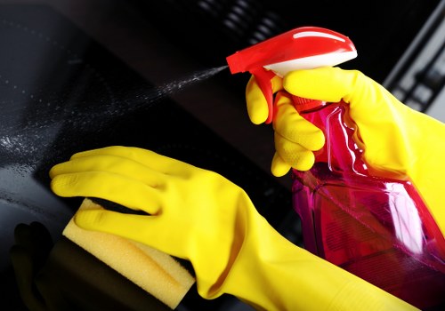 Professional carpet cleaner working carefully around furniture and flooring